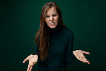 Headshot portrait of a woman with brown natural hair with confusion on her face