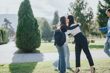 Fototapeta premium Diverse students gathering in a park for group study and collaboration. Their teamwork and effective learning result in achieving goals and better grades.