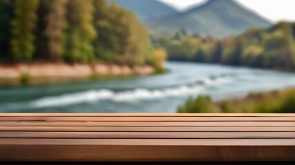 The empty wooden brown table top with blur background of river and mountain. Exuberant image.
