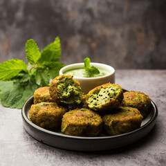 hara bhara kabab or kebab is indian vegetarian snack recipe served with green mint chutney over...