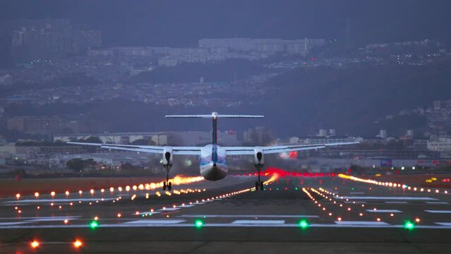 Airplane landding to the Airport at night, Tourists arrived at the airport, tourism and travel concepts, modern aviation