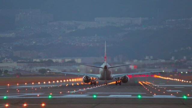 Jet Airplane take off from the Airport at night, tourism and travel concepts, modern aviation