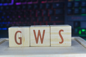 Photo of words with wooden block objects arranged into the word "GWS" in English