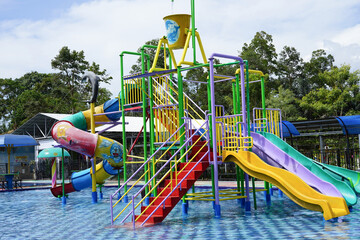 Playground with a swimming pool. water Park for children. colorful sports facilities autdoor games