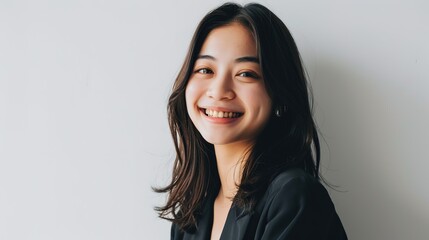 Obraz premium beautiful attractive smile young adult Asian woman in positive pose looking at the camera with happy in studio against white background