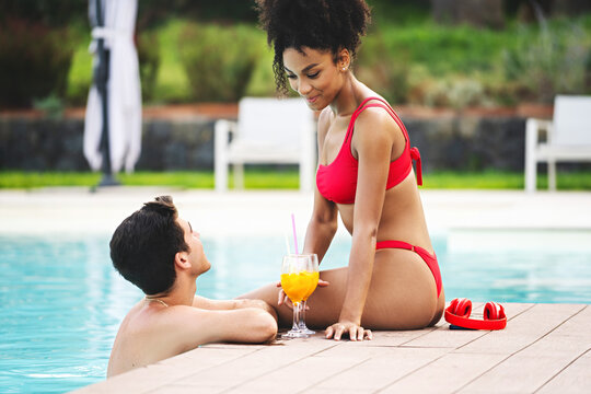 Intimate Poolside Moment for Young Couple on Vacation - Powered by Adobe