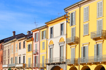 palazzi storici colorati su piazza vittoria di lodi in italia, colorful historical buildings on piazza vittoria in lodi city in italy  - 699159740