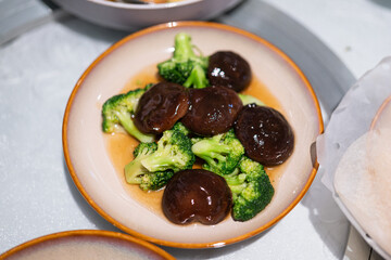 Shiitake mushroom mixed broccoli vegetable stir-fired with oyster sauce, Chinese food menu that...