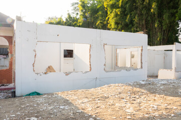 Urban Renewal: Developer's Vision in Renovating Broken Wall House Structure for Redevelopment,...