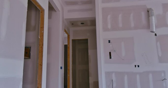 Plastering drywalling is being completed in preparation for painting new house