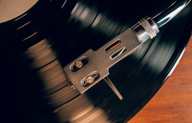 Classic stylus needle traces grooves vinyl record. Music nostalgia. Retro vibes.