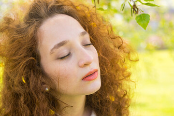 Fototapeta premium Redhead woman meditating in nature