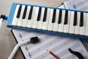 Melodica prepared for the music study with sheet music below