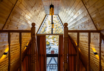 Interior of wooden A Frame cabins in the winter park