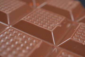 dark chocolate on a plate on table close up 