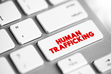 Human Trafficking is the trade of humans for the purpose of forced labour, text concept button on...