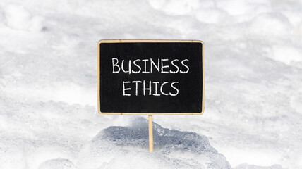Business ethics symbol. Concept words Business ethics on beautiful black chalk blackboard....