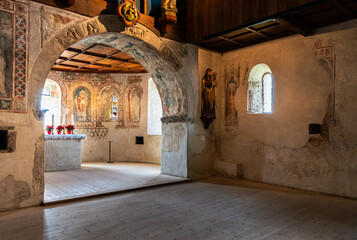 Tyrol Castle, Merano on South Tyrol, Trentino Alto Adige, Italy, June 14, 2023: interior of the Castle: lower chapel with Gothic wall paintings. Black and white image - obrazy, fototapety, plakaty