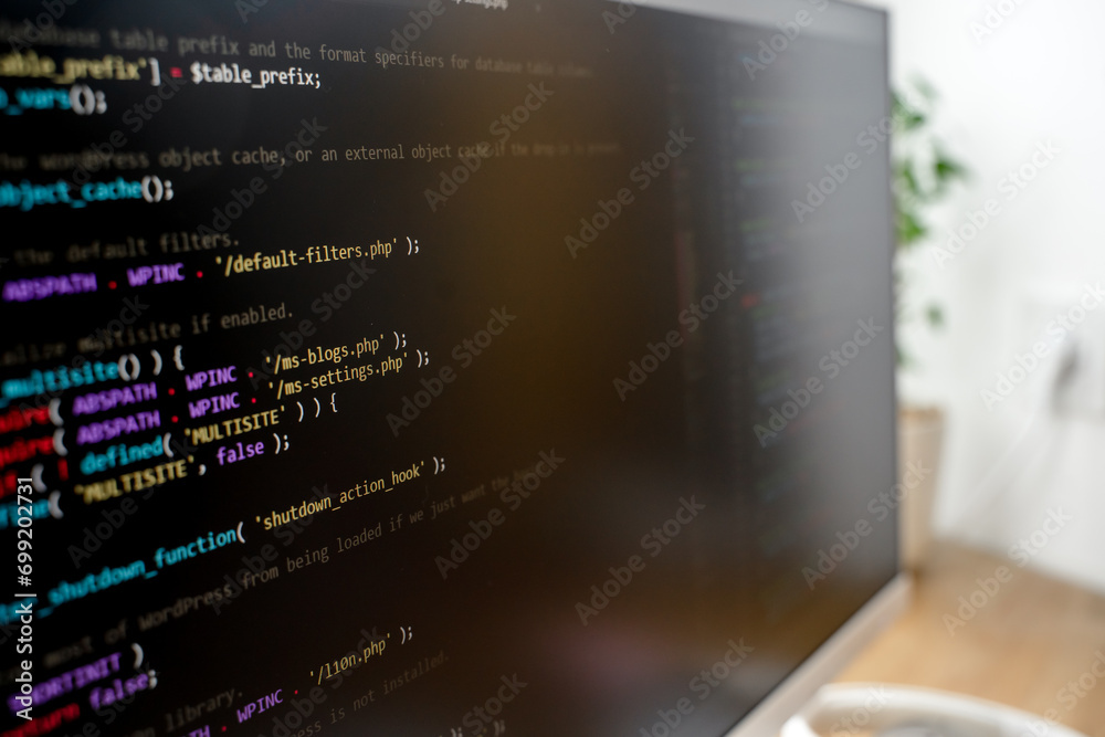 Canvas Prints html code on the screen of a white monitor standing on a wooden table with a keyboard, a coworking o