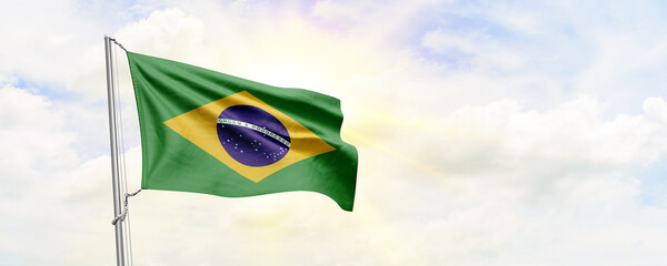 Brazil flag waving on sky background. 3D Rendering