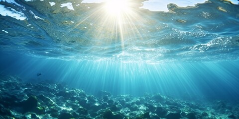 Sun rays beneath sea with bubbles ascending to water top in Mediterranean France. - obrazy, fototapety, plakaty