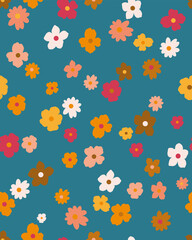 seamless colourful floral pattern, arranged in a random scatter on a blue background