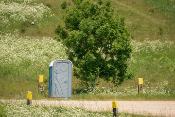 a portable self-contained toilet in countryside