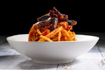 real italian Amatriciana is a typical first course of Lazio region in Italy whit tomato, bacon,...