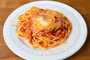 italian Amatriciana is a typical first course of Lazio region in Italy whit tomato, bacon, chili what you eat in Rome
