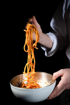 forchetta con pasta amatriciana that is a typical first course of Lazio region in Italy whit tomato, bacon, chili what you eat in Rome