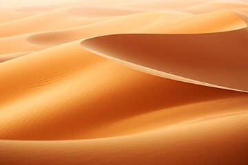 Fototapeta na wymiar Detailed view of orange sand texture in the Empty Quarter Desert in the United Arab Emirates. Features sand dunes, presenting an abstract texture