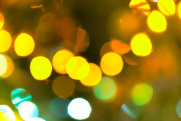 Obraz premium A mesmerizing image captures the enchanting glow of blurred lights on a Christmas tree, creating a warm and festive ambiance.