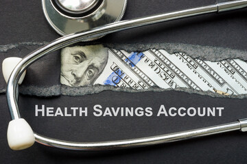 HSA health savings account sign and stethoscope.