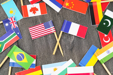 Fototapeta na wymiar The concept is diplomacy. In the middle among the various flags are two flags - USA, France