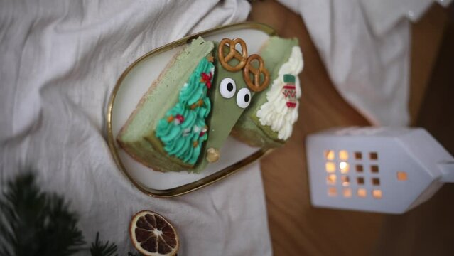 Vertical video. Cute Christmas cheesecakes. Sweet home made Festive Christmas cheesecake. Christmas new year decorations, dessert holiday food.