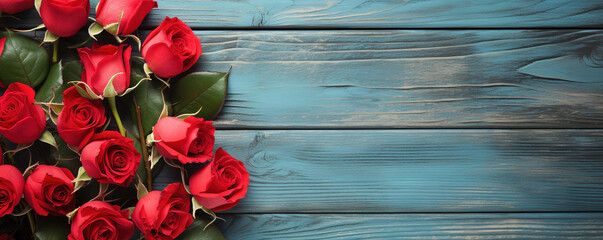 Several red roses on light blue wooden background vintage style