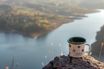 Cup of coffee on the rock