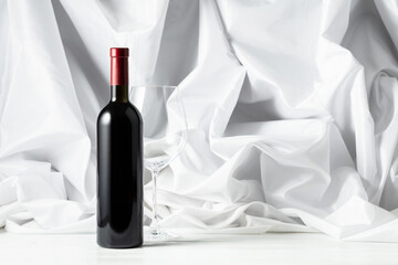 Red wine on a white wooden tfble.