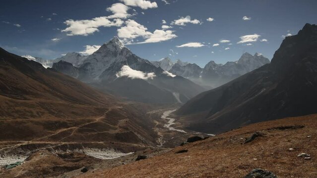 Timelapse with moving clouds over Ama Dablam Peak Himalaya Mountains, Nepal.