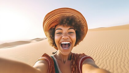 Happy female tourist taking selfie on sand dunes in the Africa desert, Sahara National Park , Influencer travel blogger enjoying trip while takes self portrait , Summer vacation and weekend activities
