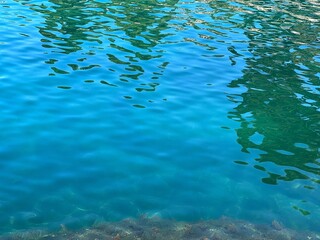Fototapeta na wymiar Sea clear water turquoise blue calm surface.