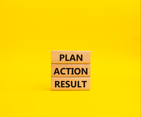 Plan Action Result symbol. Concept words Plan Action Result on wooden blocks. Beautiful yellow background. Business concept and Plan Action Result. Copy space.