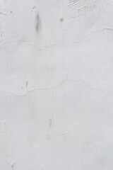 Shabby white wall with cracks