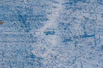Fototapeta na wymiar Shabby blue wall with cracks