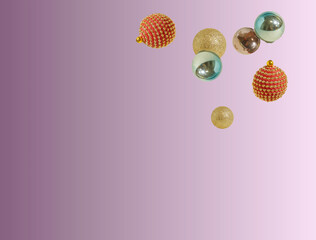 New year festive composition with shiny colorful baubles against a lilac background. Copy space. Minimal concept of holidays.