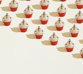 A repetitive pattern made of diagonally laid out colorful Christmas baubles in form of cakes on a beige background. Copy space.  Minimal concept of holidays.