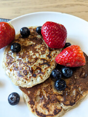 Vegan Bannana pancakes with strawberries and blueberries