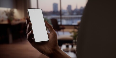 CU Black African-American man using his phone at home. Blank screen mockup