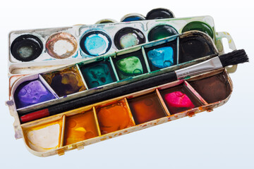 palette with watercolor paints close-up, macro, colorful background of the artist's palette, drawing