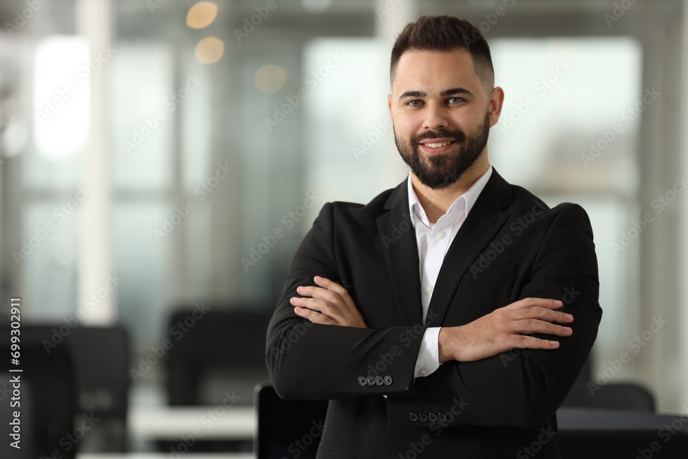 Sticker Portrait of smiling man with crossed arms in office, space for text. Lawyer, businessman, accountant or manager